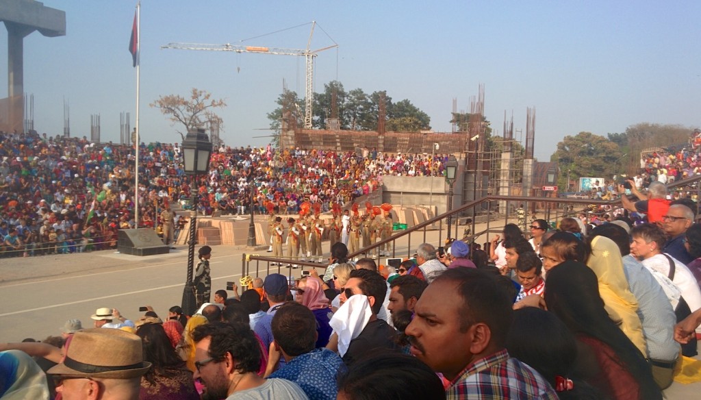 Hordes waiting for the border ceremony at Wagah. Note the decorative uniforms of the army officers in the background
